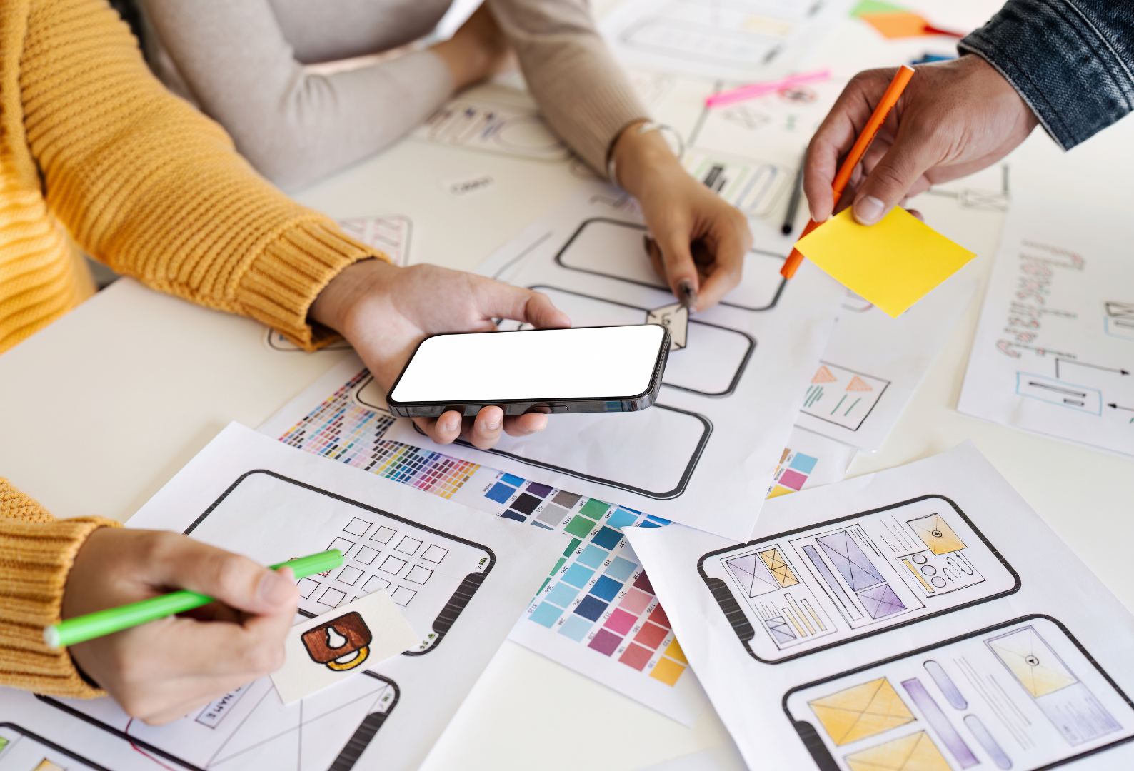 team of UI UX web designer are working together to develop mobile responsive websites. Mobile Mockup