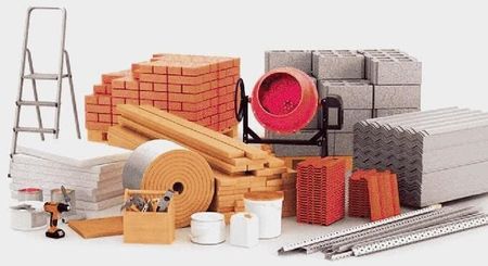 Una pila de materiales de construcción que incluye ladrillos, hormigón, madera y una escalera.