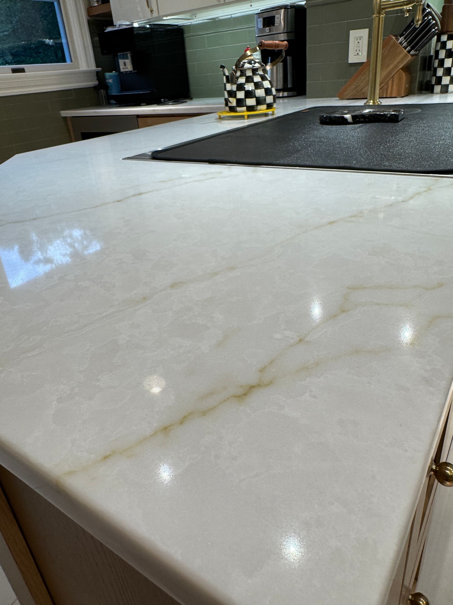 White marble countertop with a gold vein in a kitchen or café interior