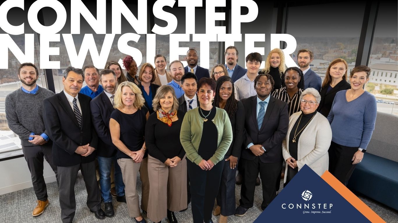 CONNSTEP team employees posing together in office