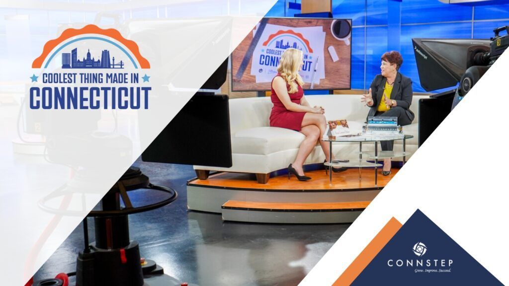 TV studio set with two women in conversation, logo