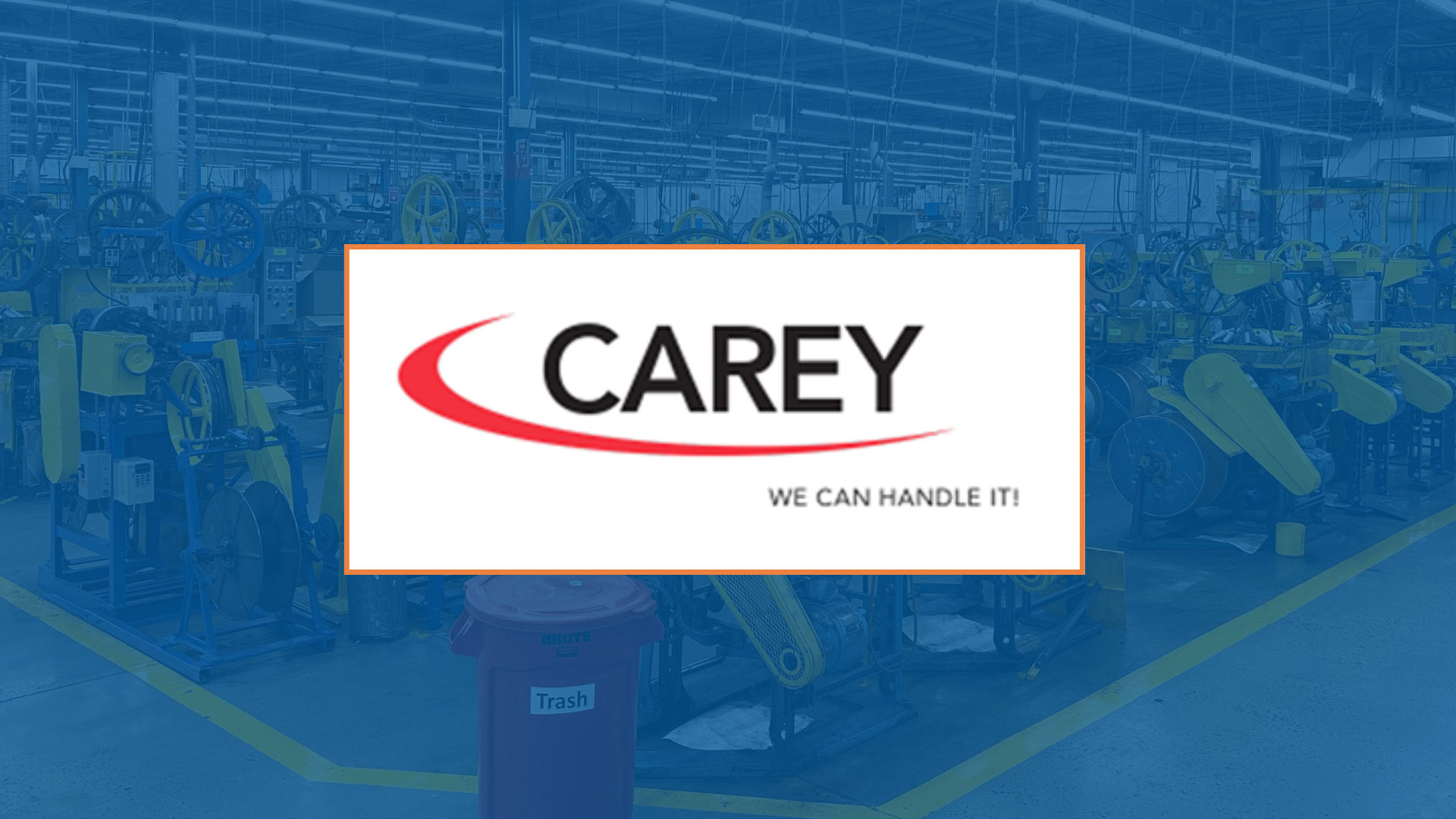 Carey logo over a factory floor. Red and black logo with slogan: 