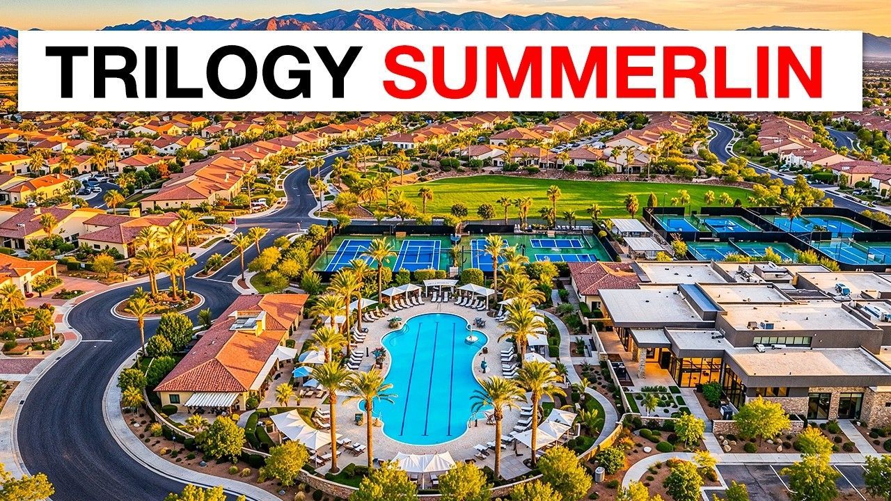 Aerial view of Trilogy Summerlin resort with pool, buildings, roads, and palm trees under a bright sky