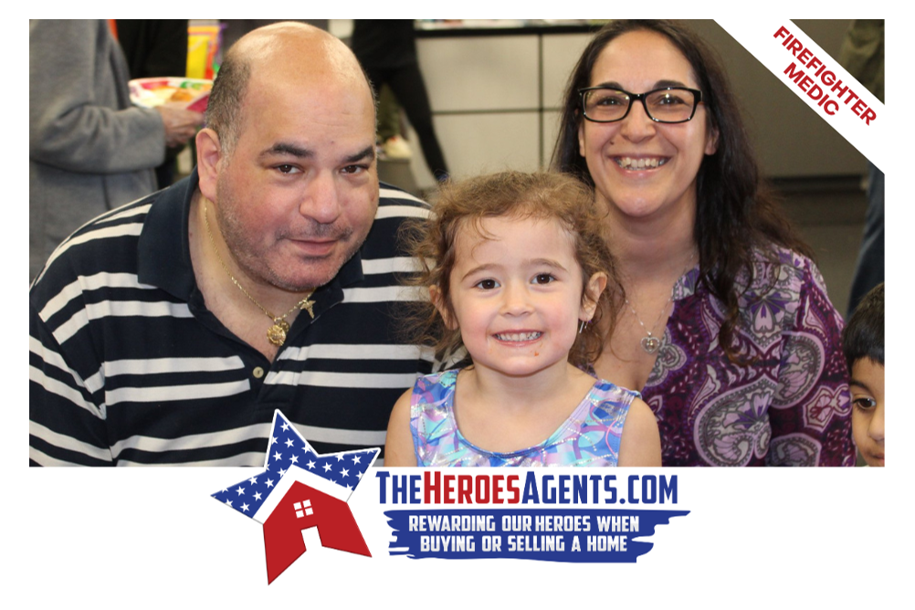 A man , woman and child are posing for a picture with the heroesagents.com logo in the corner.