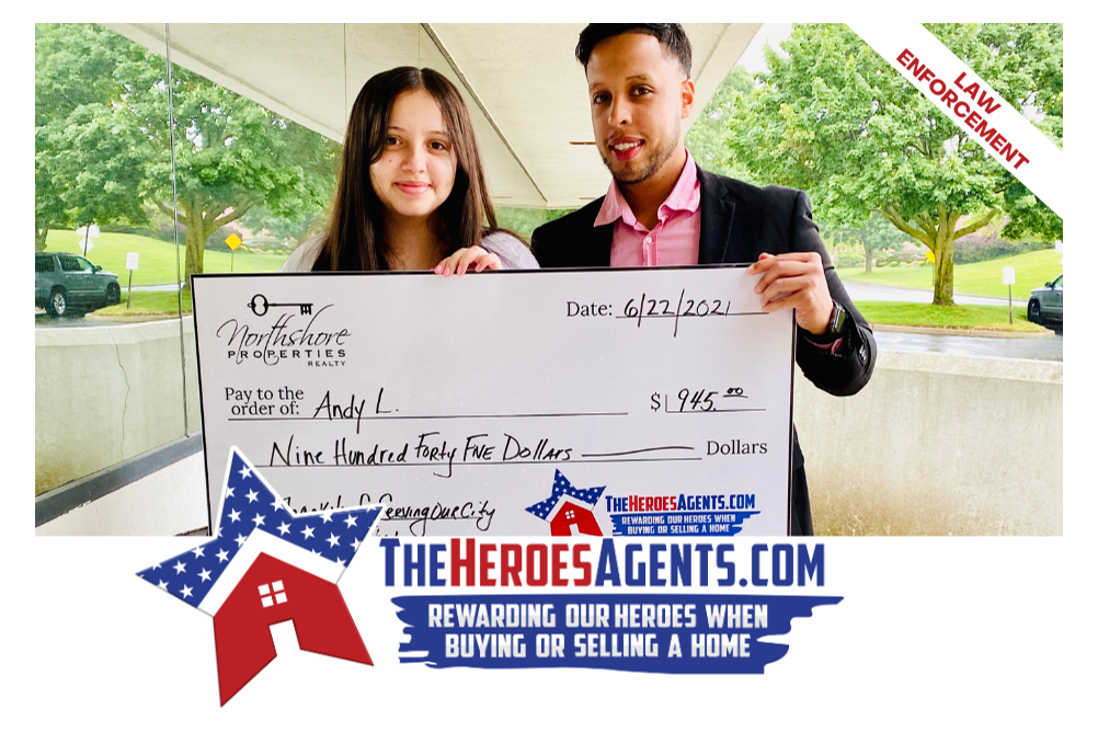 A man and a girl are holding a check in front of a sign that says the heroesagents.com
