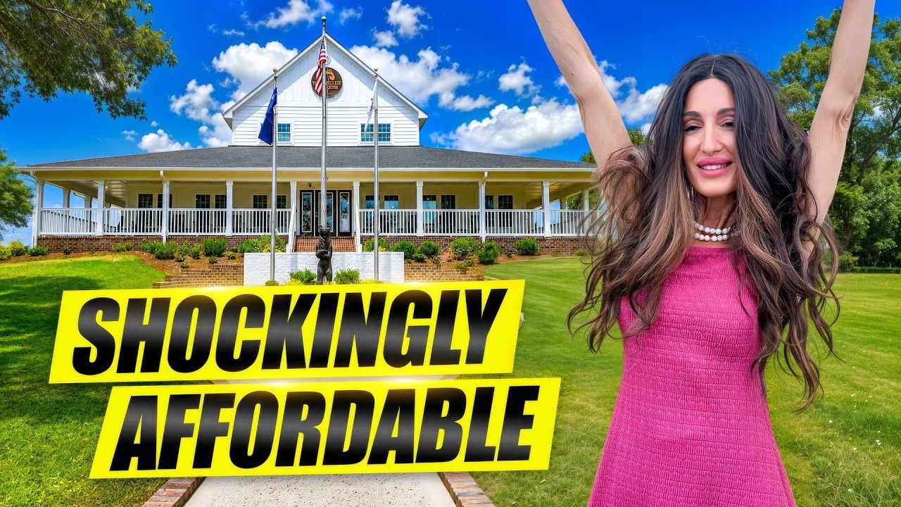 Woman in pink dress in front of a house with the words “SHOCKINGLY AFFORDABLE” and raised arms