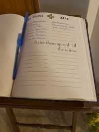Open Bible beside a blue pen on a table, with notebook pages labeled “James 5:16” and “2024” underneath.