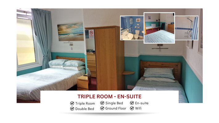 A triple room with two beds and a wardrobe