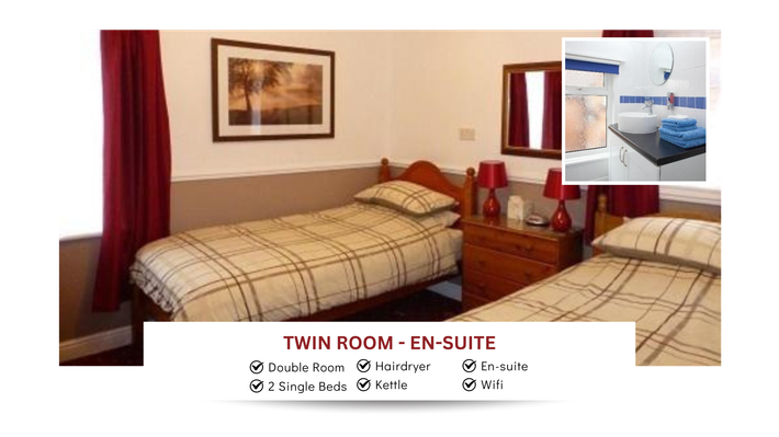 A bedroom with two beds and a picture of a bathroom