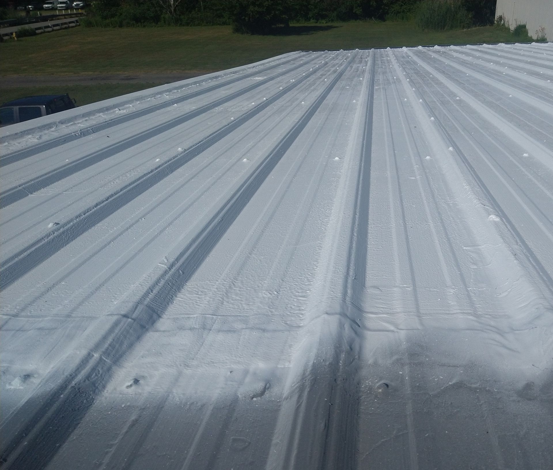 The roof of a building has been painted white