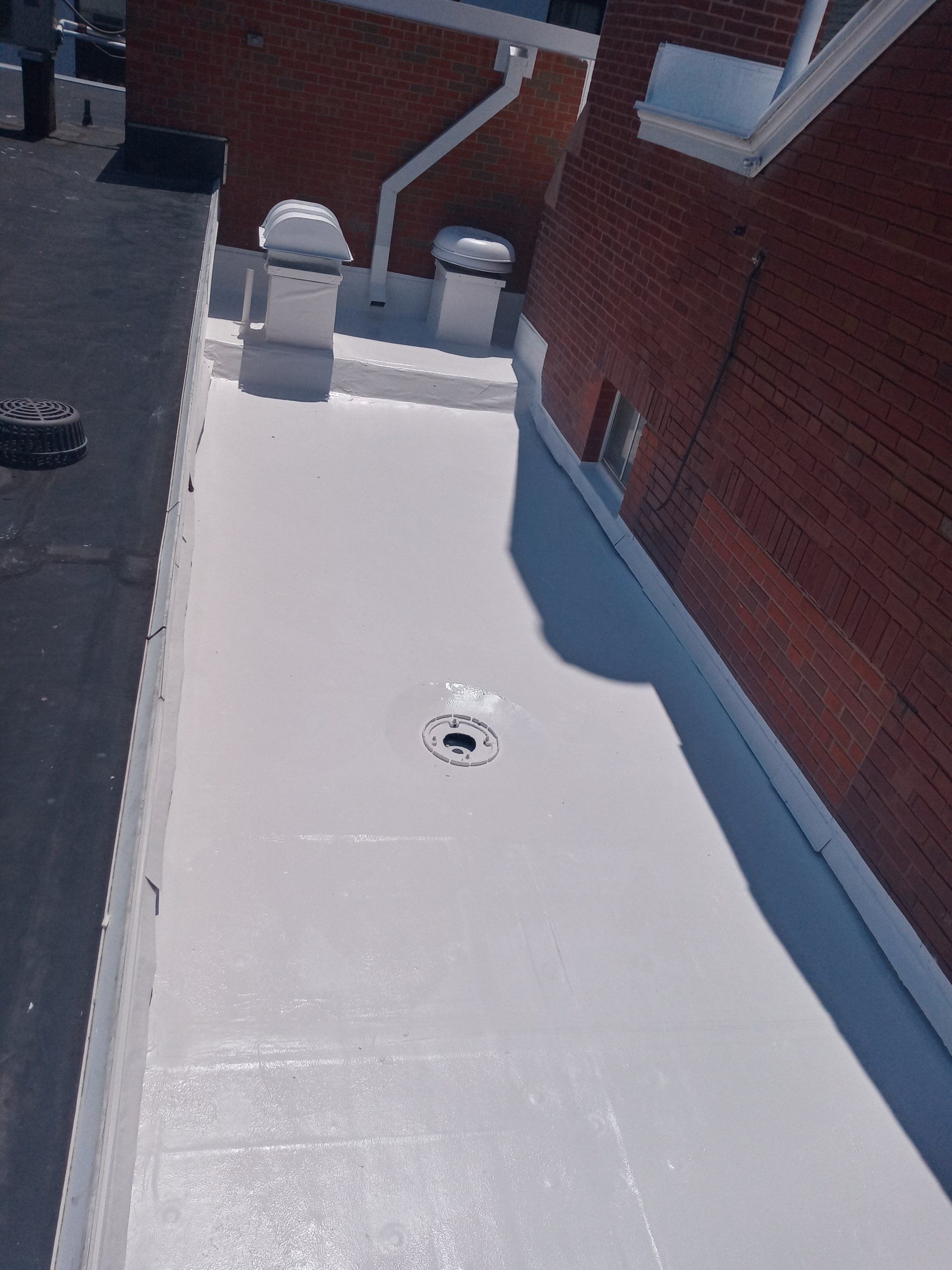 A white roof with a hole in the middle of it