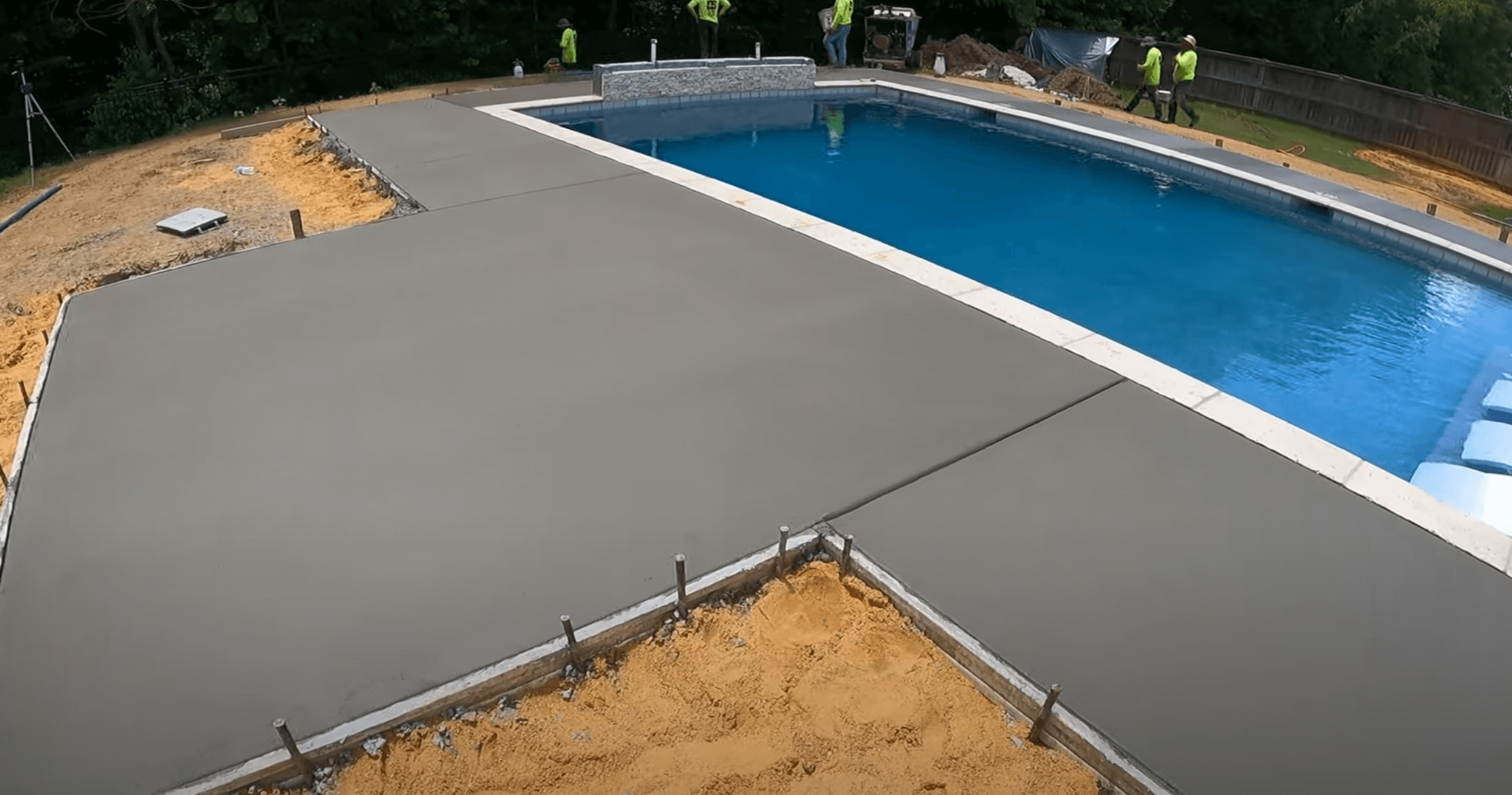 concrete pool deck in the curing phase