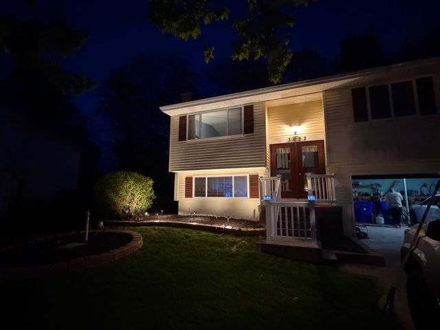The same home after dark with Hearth and Halo lighting installed