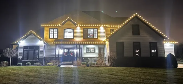 The same roofline with warm white C9 holiday lights installed