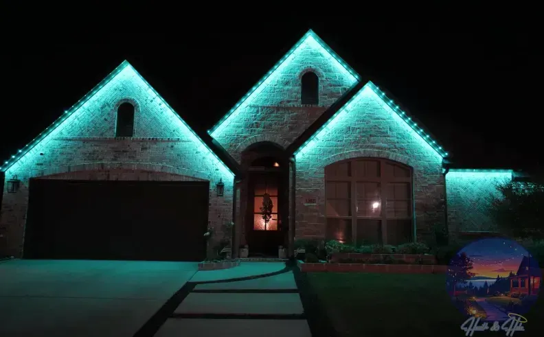 A brick house illuminated with teal lights along the roofline at night.