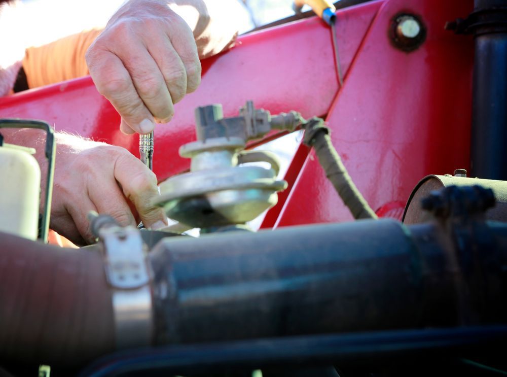 A Close Up Hands Using a Wrench to Repair a Mechanical Component — Aspire Diesel In Duaringa, QLD