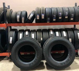 A bunch of good year tires are stacked on top of each other