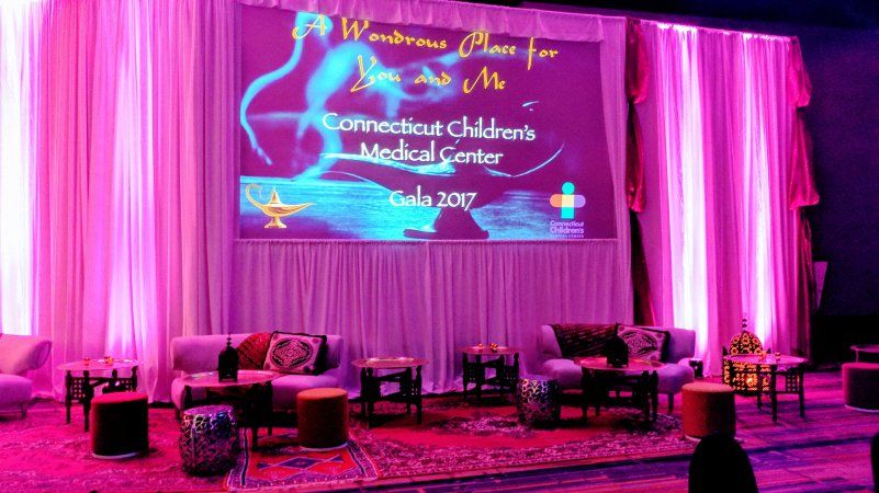 Galas and fundraising Arabian nights themed event with stage setup