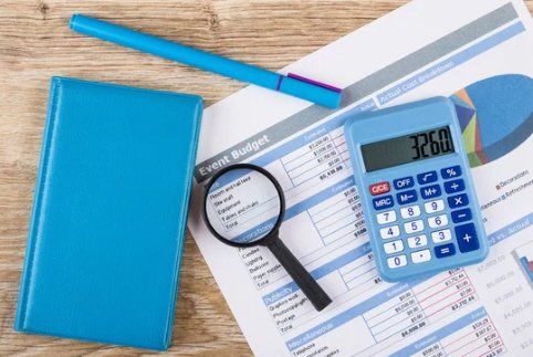 Manage your event budget with Zohar Production's Event Planning Budget Template. This event planning checklist covers event budget planning to party decorations a magnifying glass is sitting on top of a piece of paper next to a calculator .