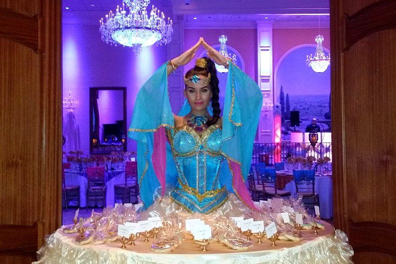 Teen birthday party Jasmin themed decor showing woman in costume