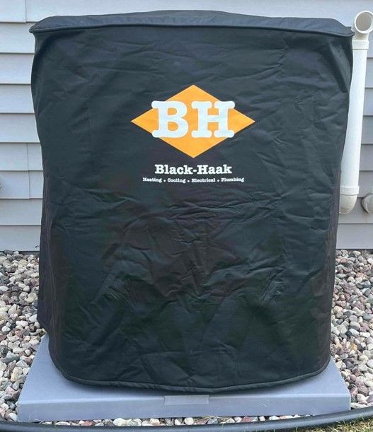 A black bag that says bh on it