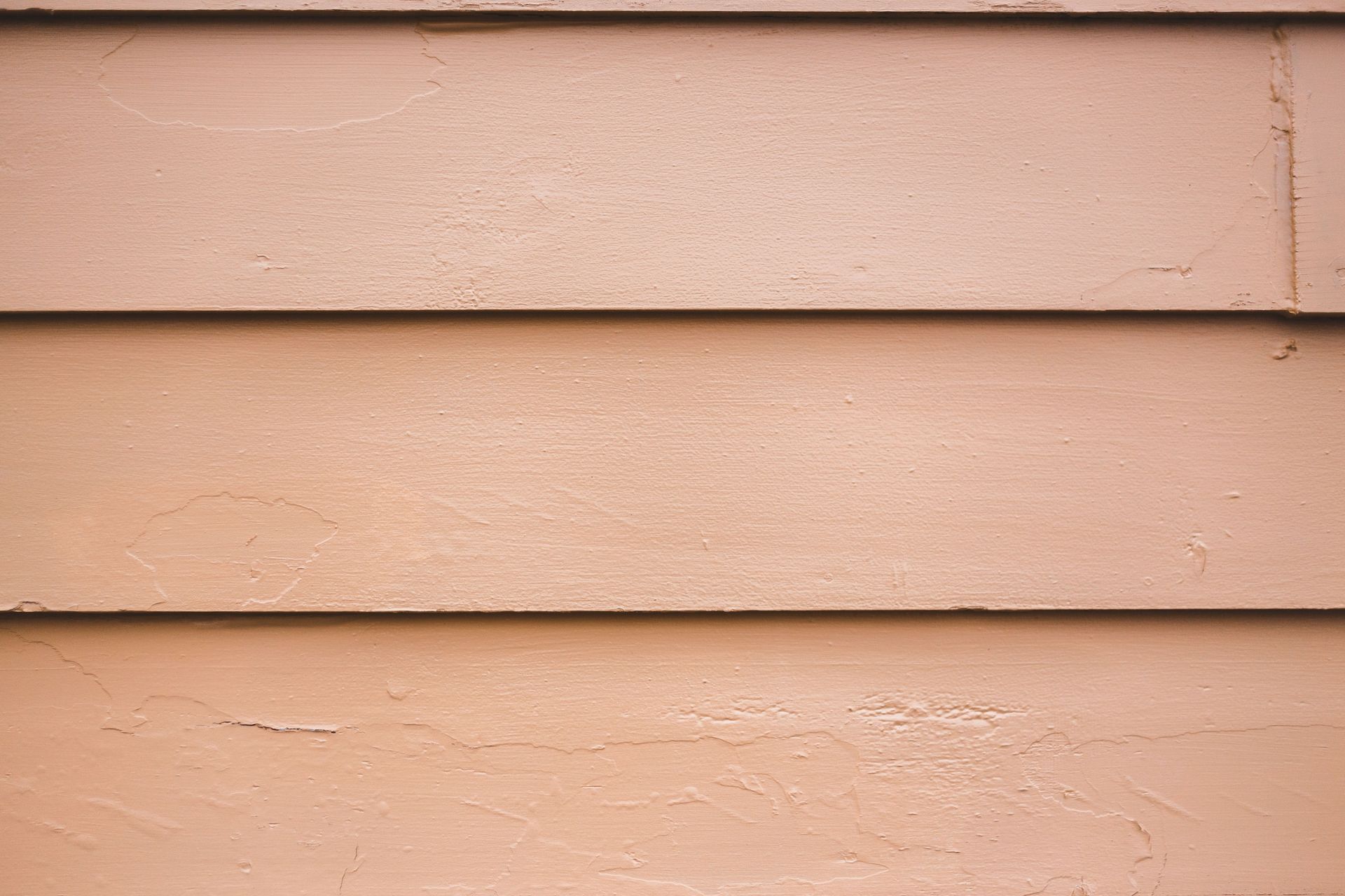 White house siding with a small window beside a white door outdoors
