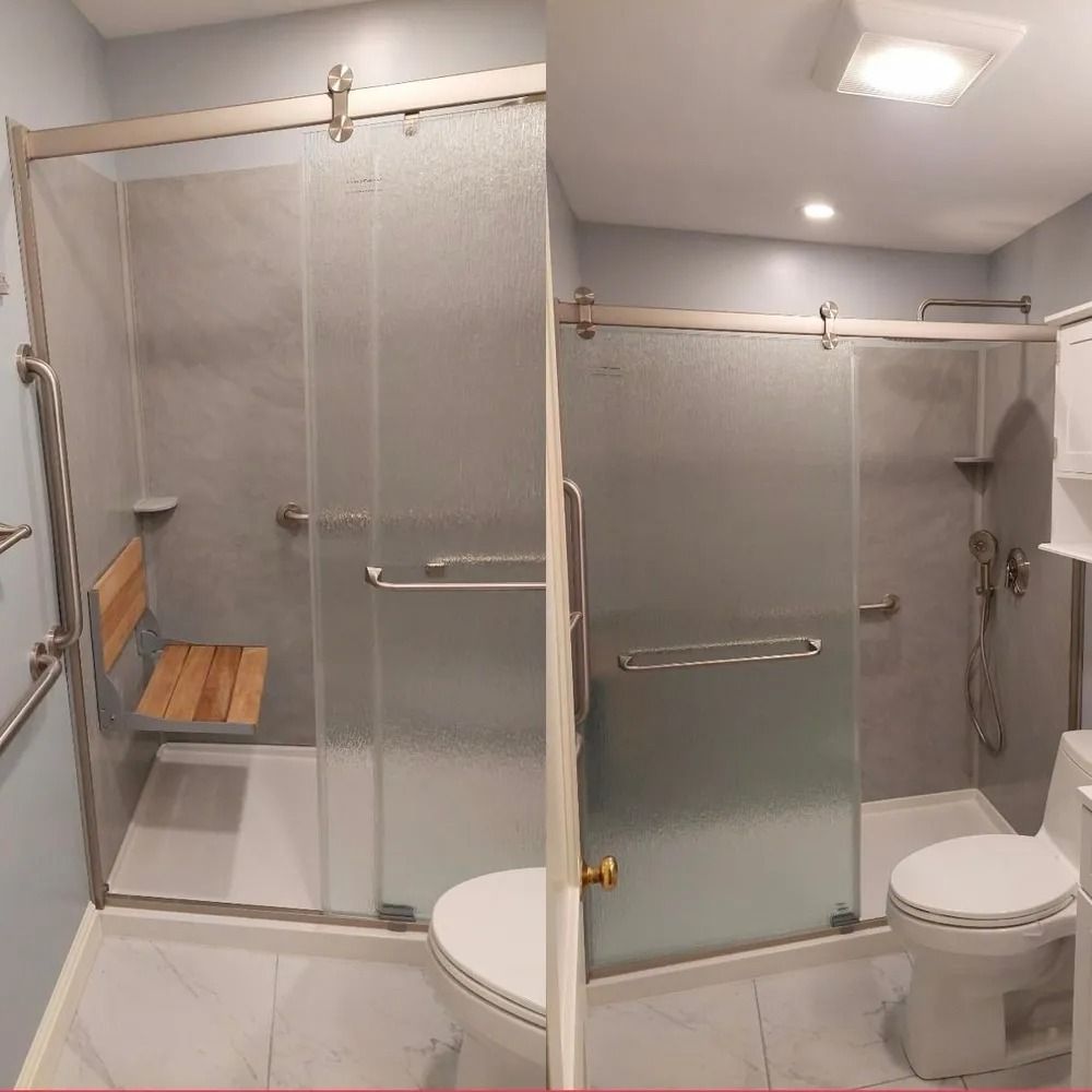 Accessible bathroom with walk-in shower, frosted glass doors, and a toilet on the right.