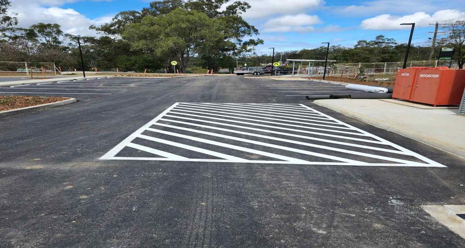 A Parking Lot With A Handicapped Parking Spot Painted On It — Spraywayz Linemarking Pty Ltd In Booral, QLD