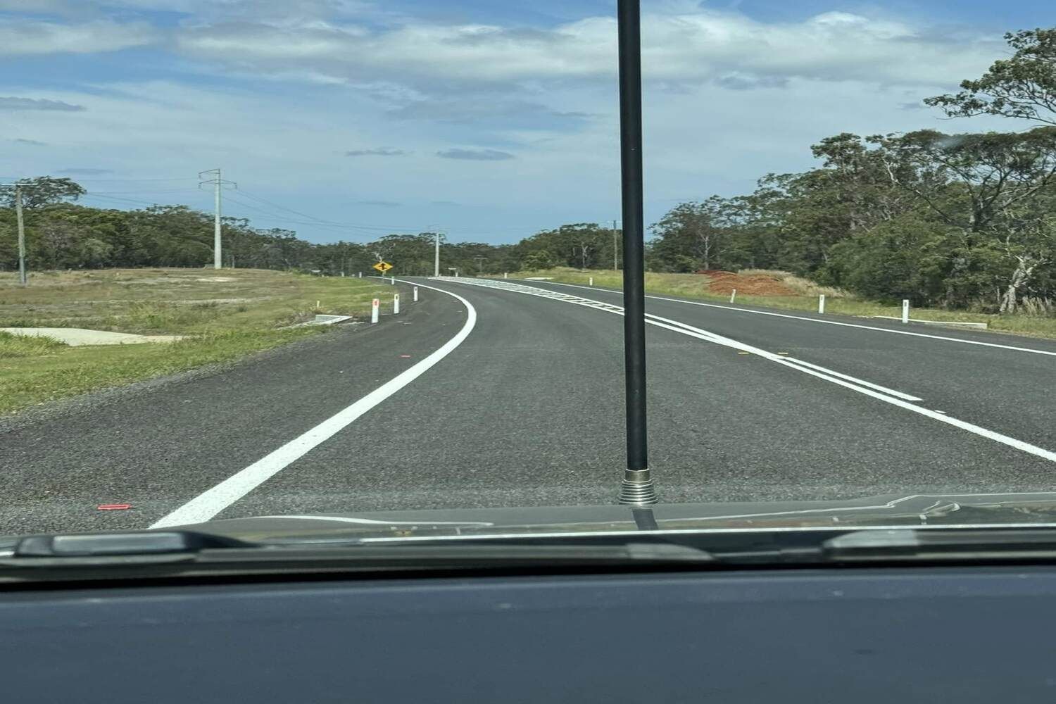 A View Of A Road Through A Car Windshield — Spraywayz Linemarking Pty Ltd In Booral, QLD
