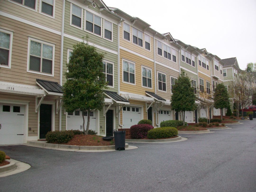 P3 painters preparing and coating exterior surfaces at an Atlanta property