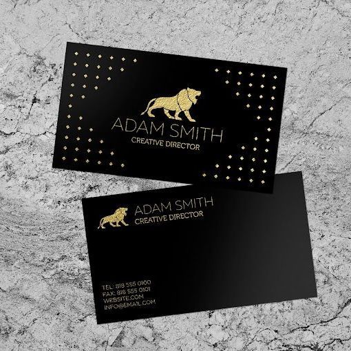 A black business card with a gold lion on it