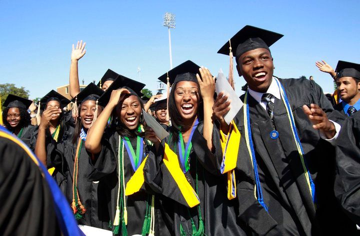 Students react during the graduation ceremony of the 2010 class at Hampton University in Virginia May 9, 2010. U.S. President Barack Obama delivered the commencement address at the graduation and was conferred an honorary doctor of laws degree. REUTERS/Jason Reed (UNITED STATES - Tags: POLITICS EDUCATION IMAGES OF THE DAY)