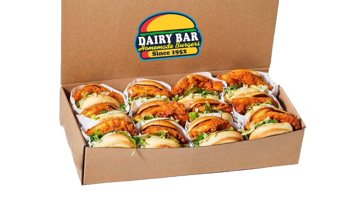 A plastic container filled with a salad and ranch dressing.