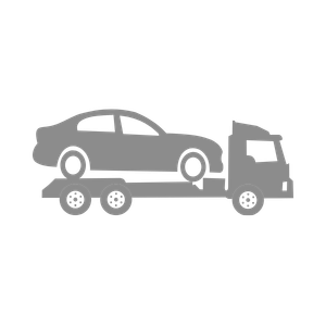 Gray tow truck carrying a gray car on a flatbed truck
