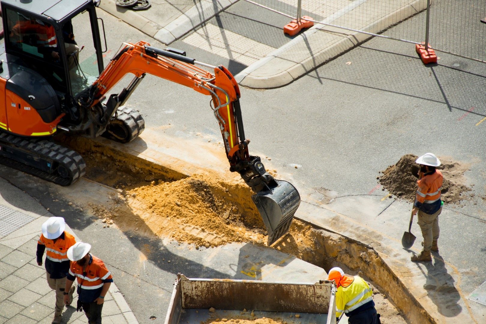 A group of construction workers are working on a construction site.