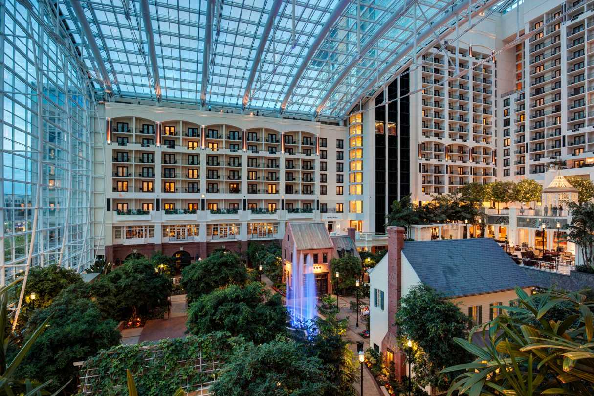 A large building with a waterfall in the middle of it.