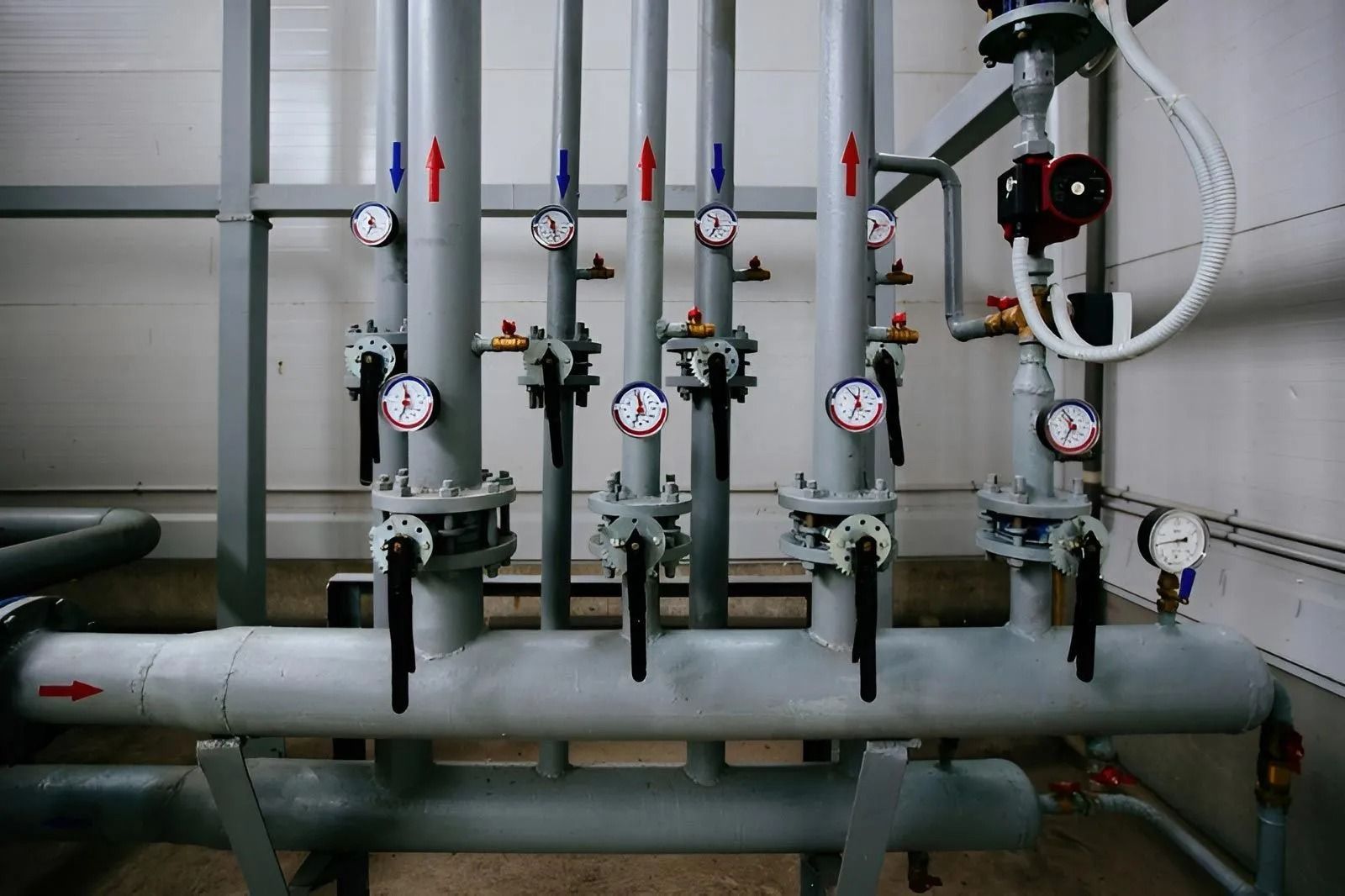 A Series of Industrial Pipes With Pressure Gauges — Dunnrite Plumbing Services in Cannonvale, QLD