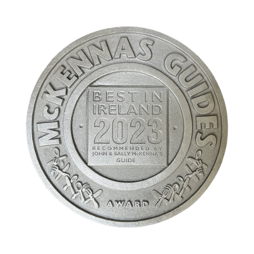 A silver coin that says best in ireland 2023 on it.