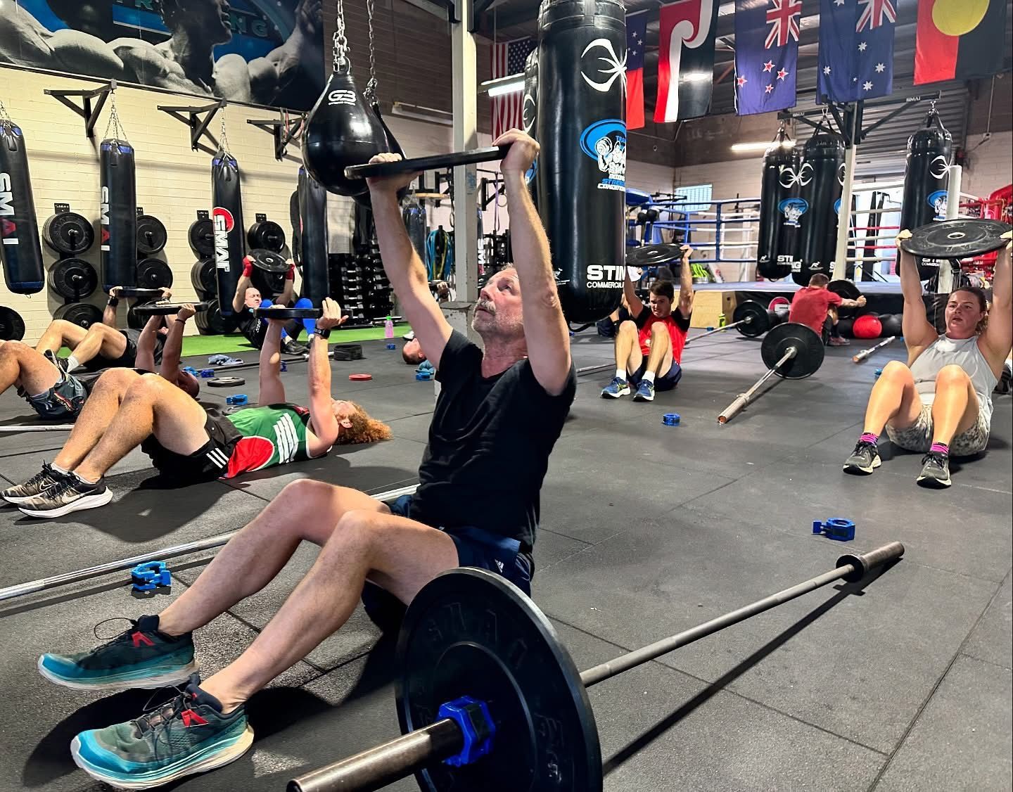 A group of people are working out in a gym.