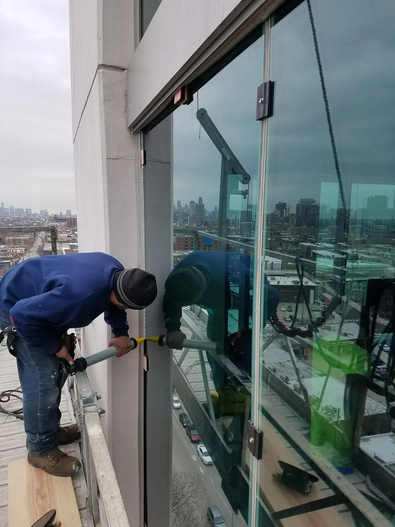 Technician repairing a commercial door closer in Chicago Technician repairing a commercial door closer in Chicago