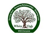 A white oak logo with a tree in the center