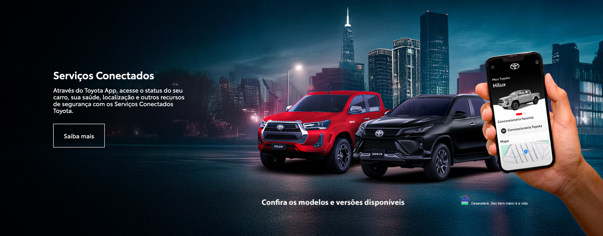 Caminhonetes Toyota vermelhas e pretas, smartphone mostrando aplicativo, cidade à noite. Texto: