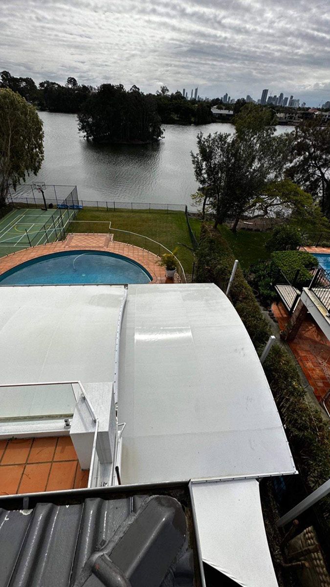 A View Of A Swimming Pool From The Top Of A Building — Clean Cartel Pressure Washing In Reedy Creek, QLD