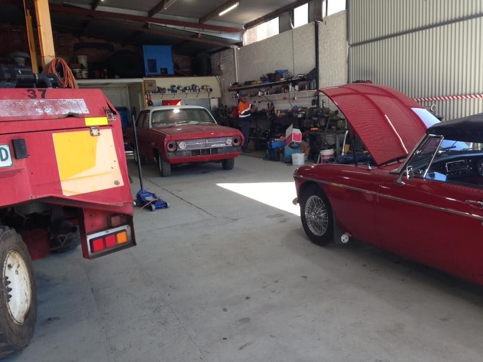 Red Car Inside The Workshop — Towing Service In Gilgandra, NSW
