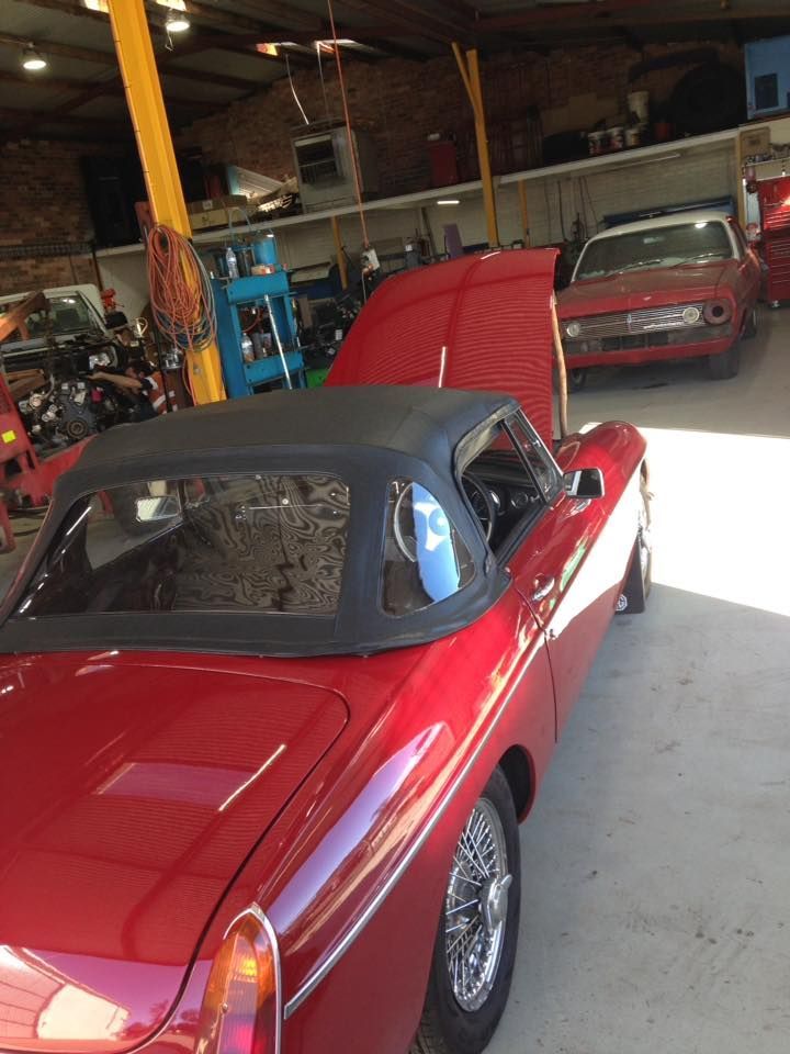 Red Car With Open Car Hood Inside The Workshop — Towing Service In Coonabarabran, NSW