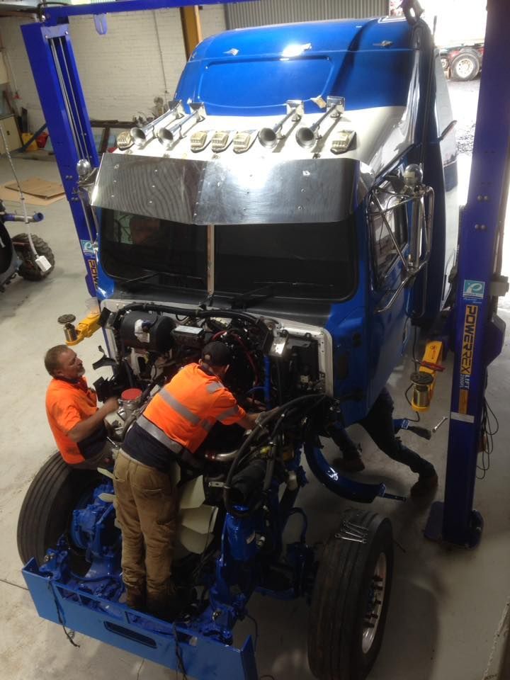 Two Mechanics Repairing The Big Blue Truck — Towing Service In Gilgandra, NSW