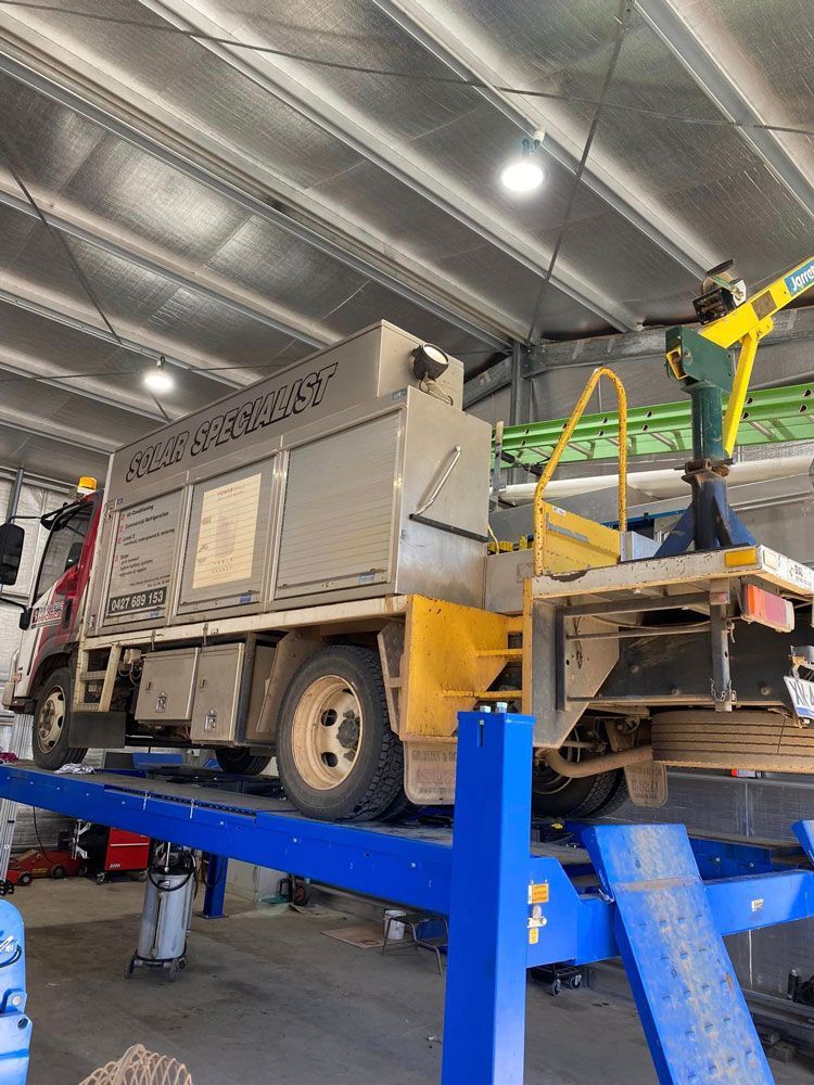 Truck On Vehicle Lift — Towing Service In Mudgee, NSW