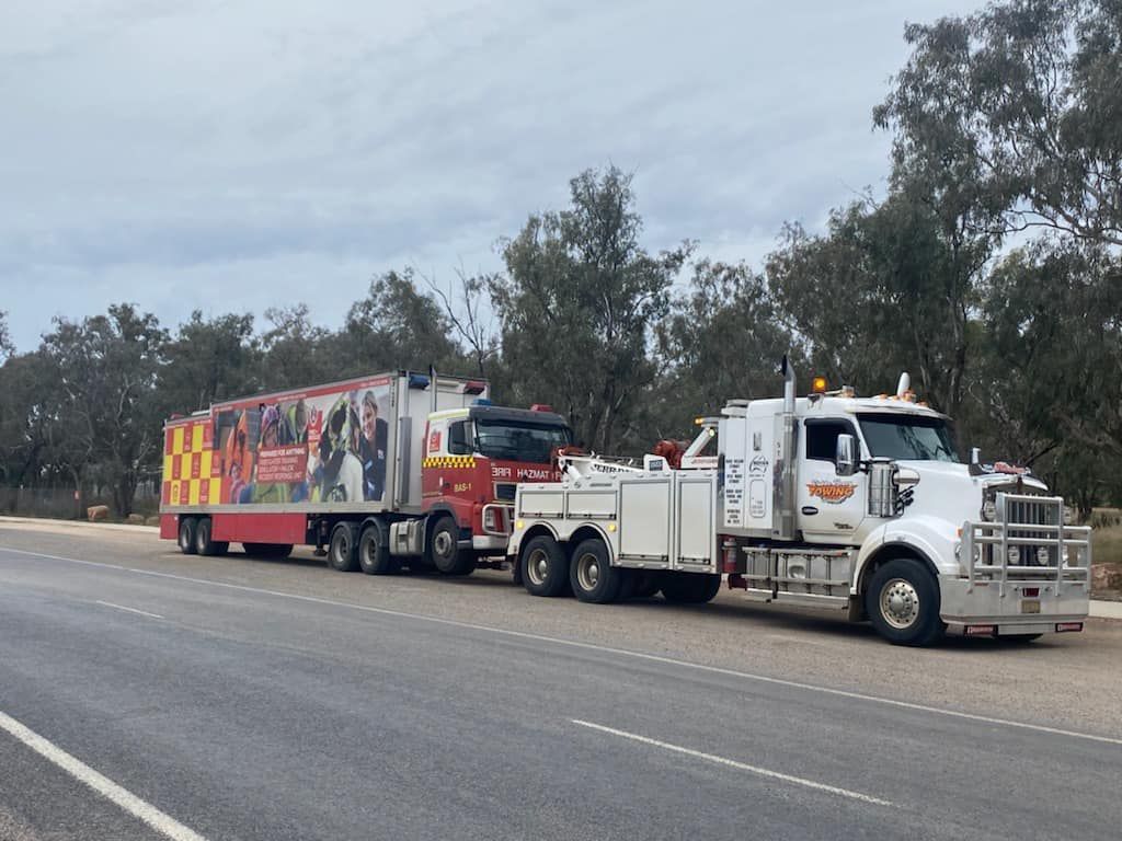 Tow Truck And Trailer Truck On Road — Towing Service In Cobar, NSW