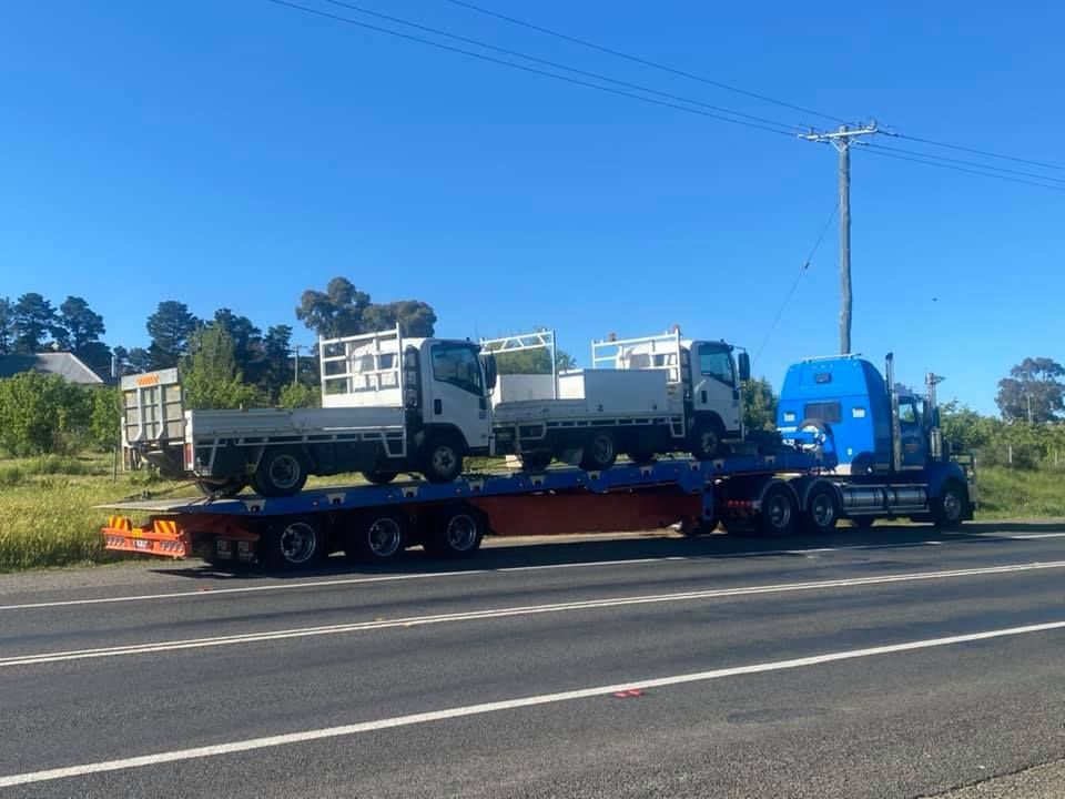 Two Trucks On Tow Truck On Road — Towing Service In Narromine, NSW