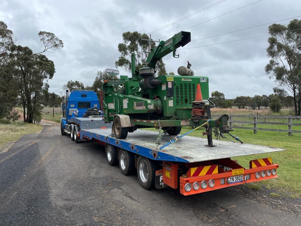 Tow Truck Transporting Wood Shredder Chipper Machine — Towing Service In Coonabarabran, NSW